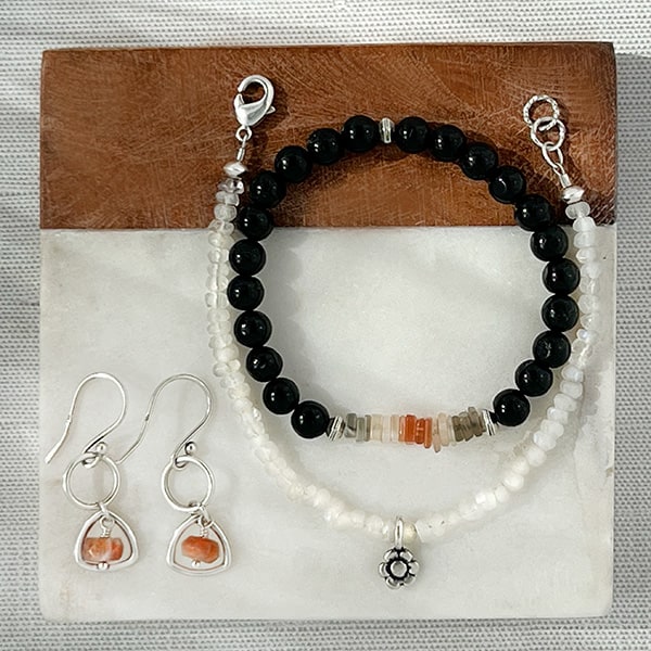 Lunar Shield Bracelet shown with the Rainbow Moonstone & Flower Charm Bracelet and Peach Moonstone SS Earrings