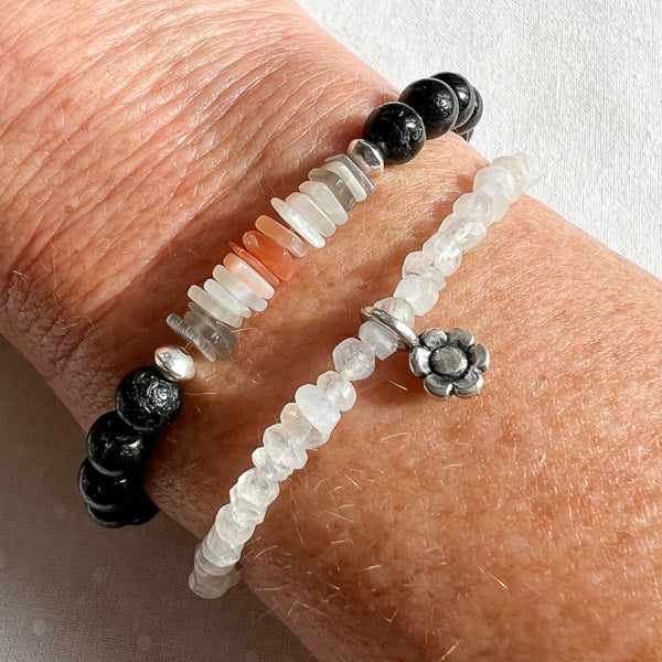 Rainbow Moonstone & Silver FLower Charm bracelet worn with the Lunar Shield & Black Tourmaline Bracelet. 