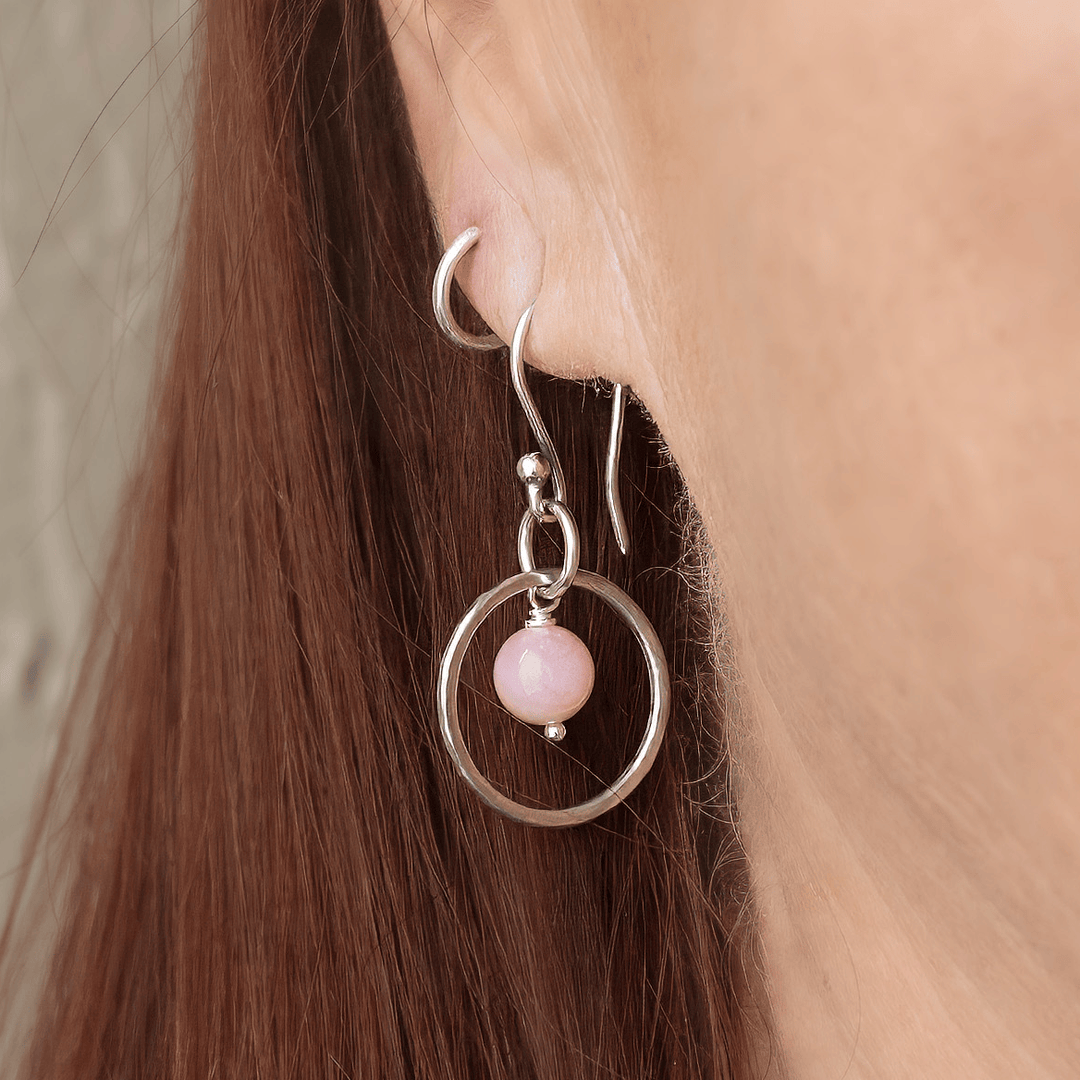 Close up image of the Pink Flake Moonstone and Sterling Silver OPen CIrcle Earrings. 