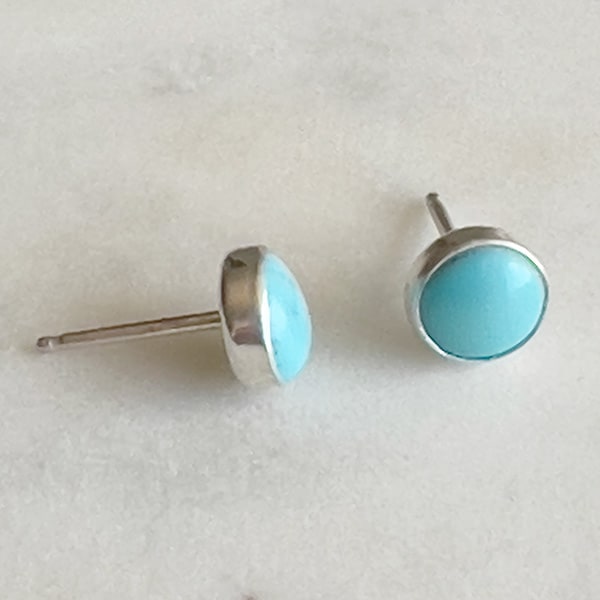 These Sleeping Beauty turquoise studs are perfect for adding a pop of color to your everyday outfit. The combination of sterling silver and natural turquoise creates a timeless look that will never go out of style.