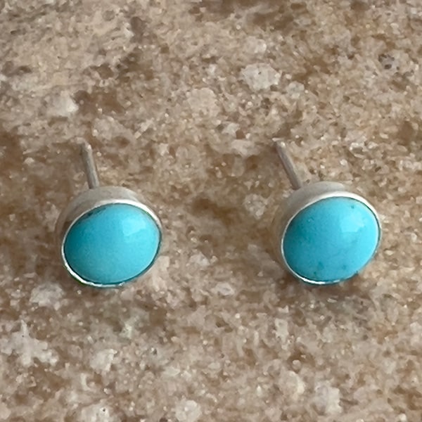 These Sleeping Beauty turquoise studs are perfect for adding a pop of color to your everyday outfit. The combination of sterling silver and natural turquoise creates a timeless look that will never go out of style.