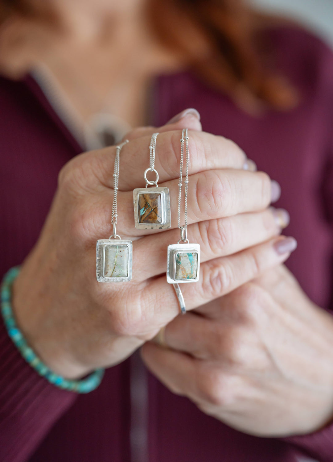 Laura Novak-Roesgen wearing handcrafted turquoise jewelry on Southern California coast