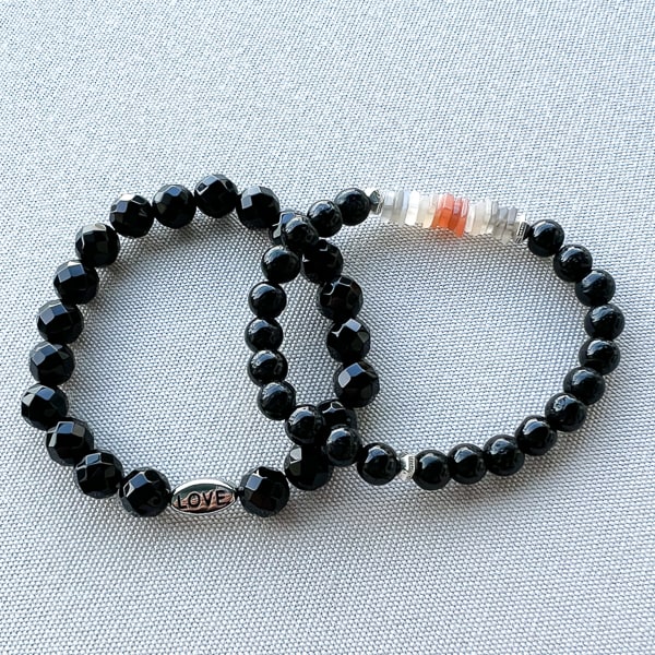 Lunar Shield Bracelet shown stacked with the Black Onyx LOVE Bead Bracelet.