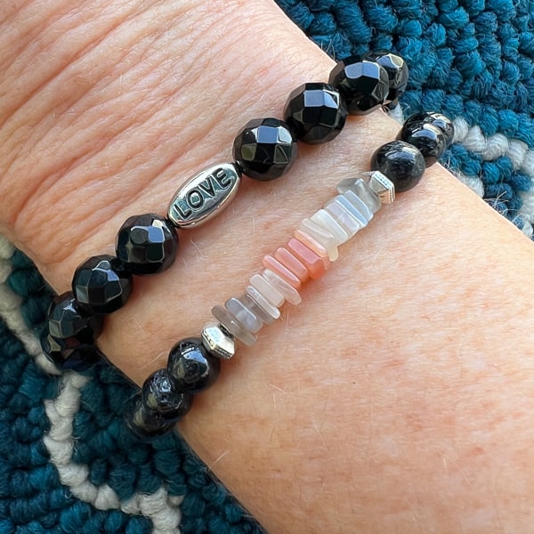 Lunar Shield Bracelet worn with the Black Onyx LOVE Bead Bracelet.