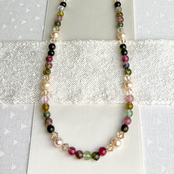 Are you a Pearl or a Gemstone gal? Have both with this Tourmaline and Pearl necklace. Wear to your next wedding event, date night with your partner, or business conference. You will turn heads with this stunner. Handcrafted in CA.